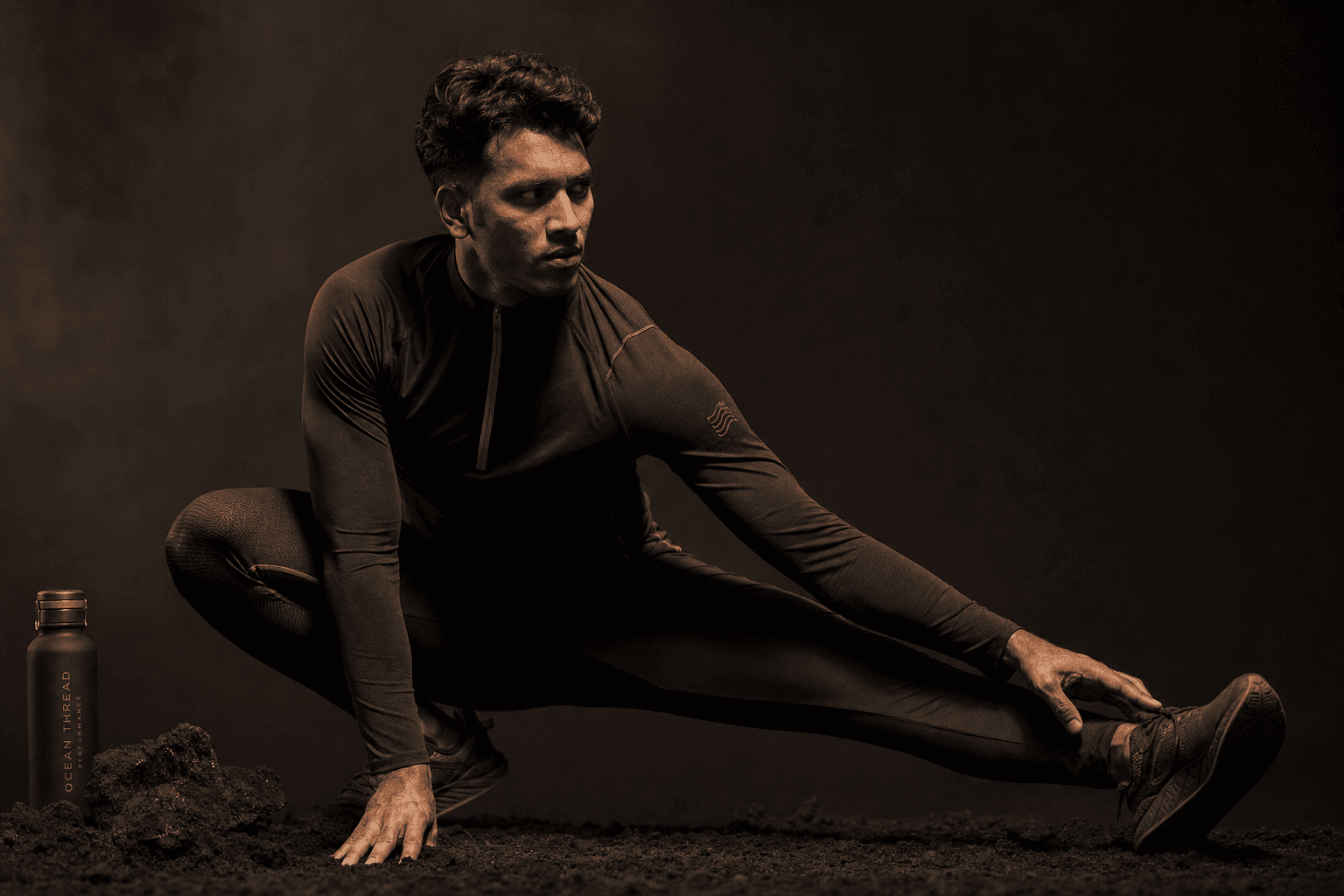 Athlete in modern sustainable performance wear stretching in a bright clean studio